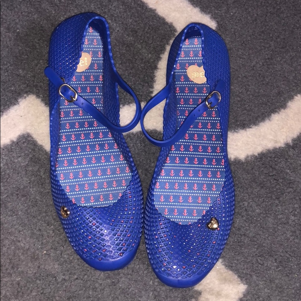 Royal blue Mel flats with a ankle strap.